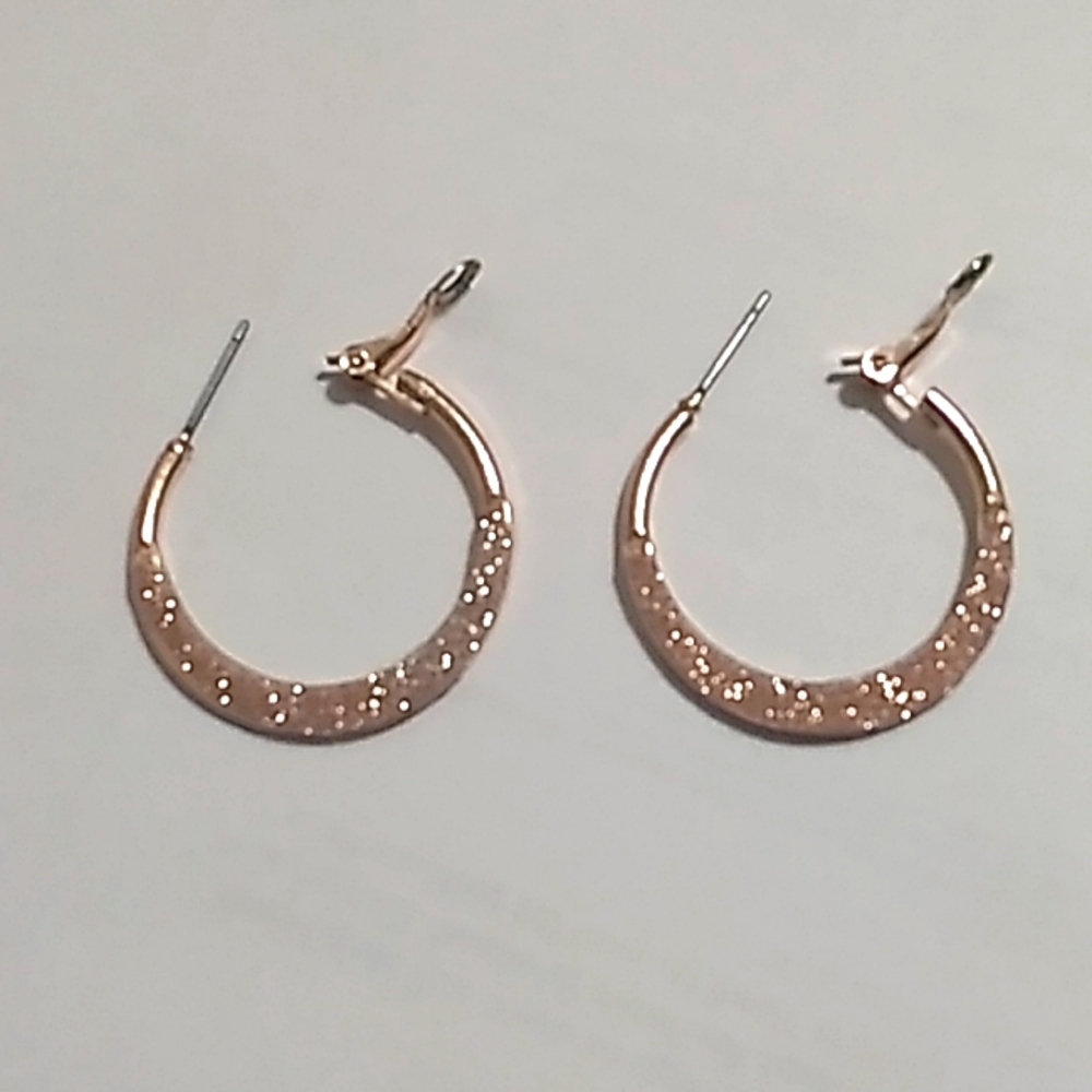 Rose gold colored earrings